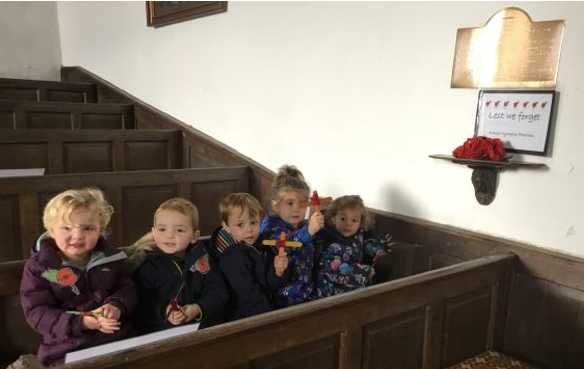 School children in church pew on Remembrance Day