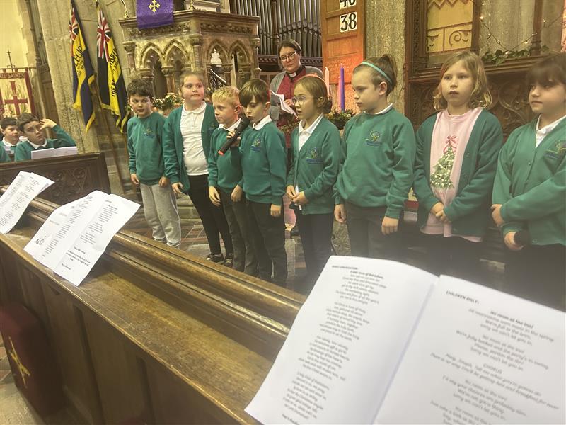 School children in church pew on Remembrance Day